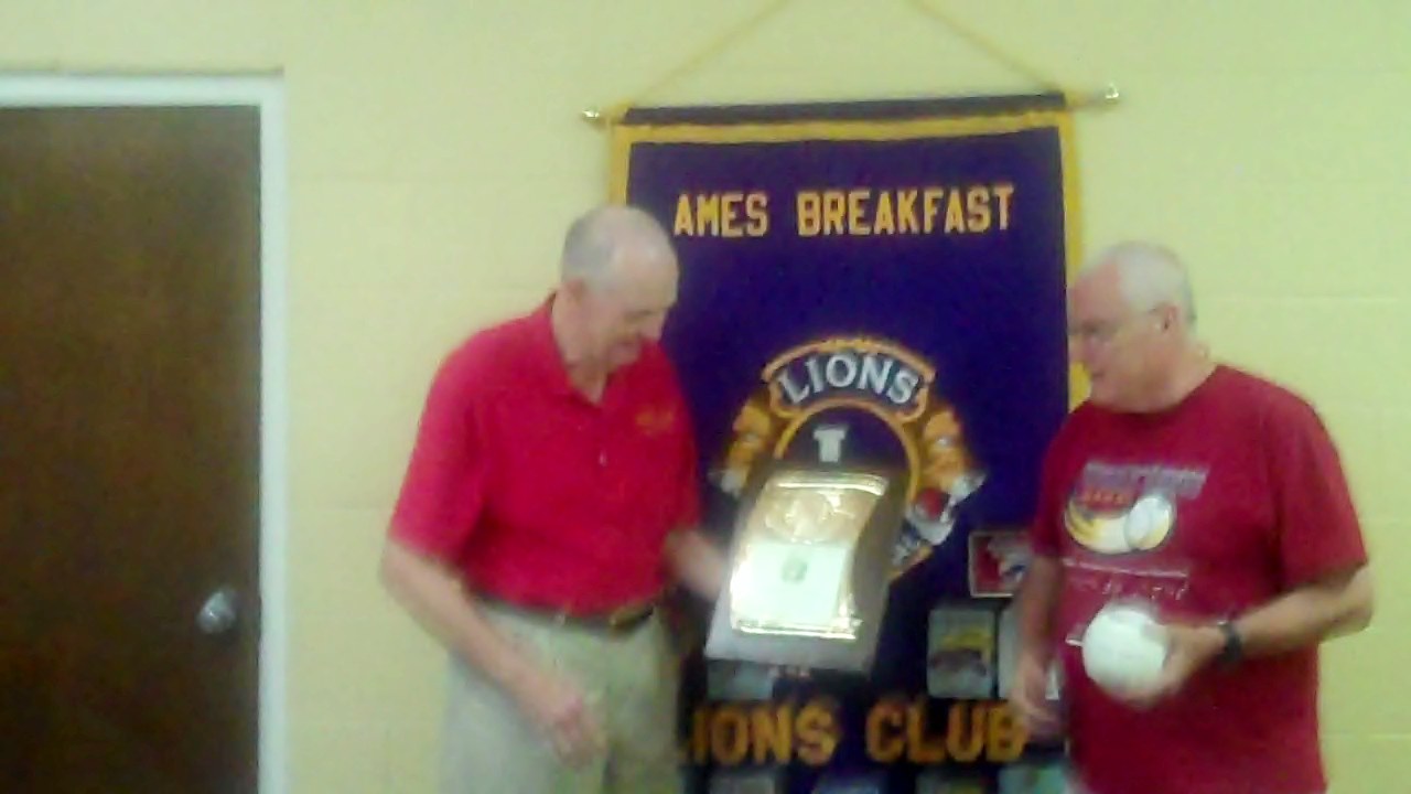 Nathan Tosten being presented a Warren Coleman Plaque by President David Williams for Nathan's outstanding service in Ames Community....latest being his leadership provided to the World Series Beep Ball for the sight impaired.