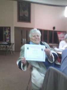 Maggie Stout Presented with a certificate for 